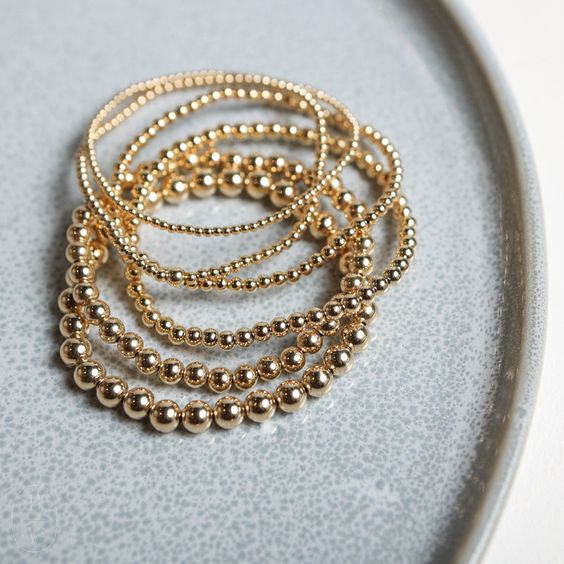 Pulseras beads en chapa de oro.